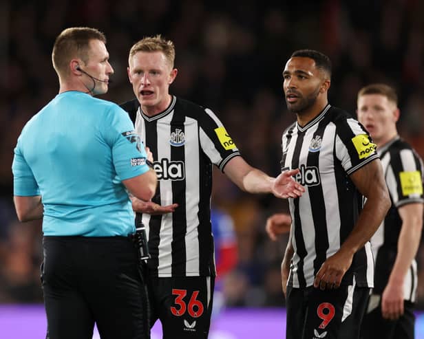Sean Longstaff and Callum Wilson of Newcastle United interact with referee Tom Bramall during the Premier League match between Crystal Palace and Newcastle United at Selhurst Park on April 24, 2024 in London, England. (Photo by Ryan Pierse/Getty Images)
