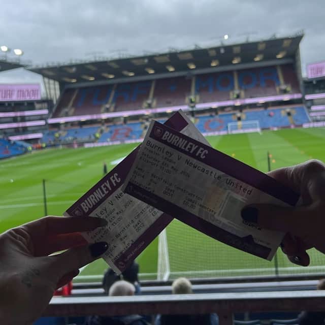 The pair hold their tickets up from the Newcastle United away end.