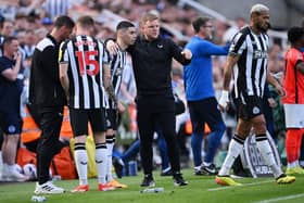 Eddie Howe, Manager of Newcastle United, talks to Miguel Almiron. (Photo by Stu Forster/Getty Images)