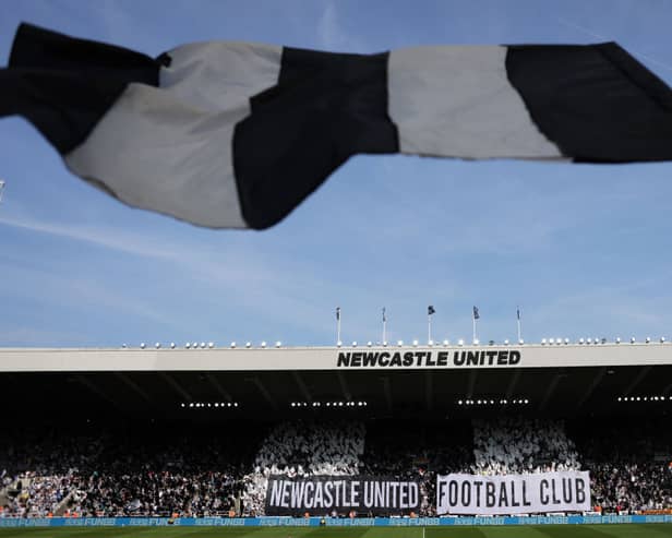 Fans of Newcastle United show their support with banners and flags prior to the Premier League clash against Brighton. (Photo by George Wood/Getty Images)