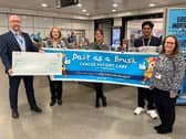 The cheque presentation for Daft As A Brush on the concourse of Central Metro station, in Newcastle. From left: David Wilson, Daft As A Brush development manager, Deb Stephenson, Jenni Daglish and Subham Singh, from Nexus who played a big role in the fundraising activities, and Cathy Massarella, Nexus managing director. Photo: Nexus.
