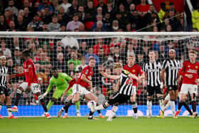 Lewis Hall of Newcastle United scores his team's second goal during the Premier League match between Manchester United and Newcastle United at Old Trafford on May 15, 2024 in Manchester, England. 