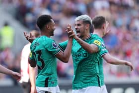 Jacob Murphy and Bruno Guimaraes celebrate in Newcastle’s win on Sunday.