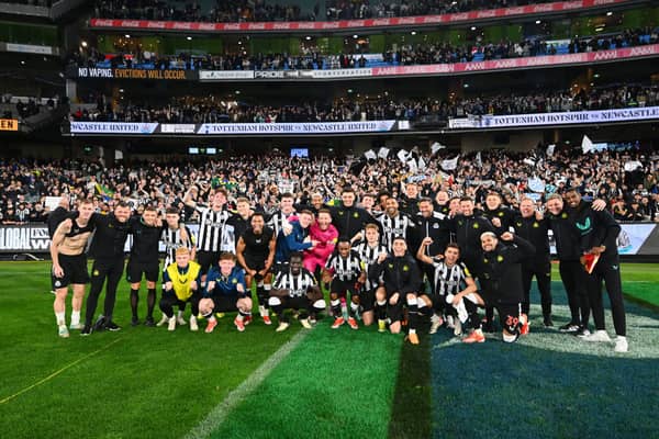 Newcastle United players and staff pose for a team photo following their exhibition match win over Tottenham Hotspur. (Photo by Morgan Hancock/Getty Images)