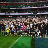 Newcastle United players and staff pose for a team photo following their exhibition match win over Tottenham Hotspur. (Photo by Morgan Hancock/Getty Images)