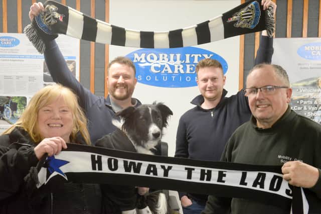 Editor, Liam Kennedy and football writer Jordan Cronin with Mobility Care Solutions Claire and Terry Batten, and dog Murphy.
