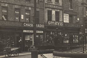 The Groat Market is now a hub for Newcastle's nightlife, with those buildings today occupied by takeaway shops and bars. The public toilet seen in the right corner is also a bar.