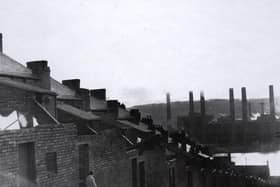  A copy of a photograph of the rear of Clara Street Benwell taken in 1967/8. The photograph is looking down the back lane towards the River Tyne and across to Dunston Power Station. 