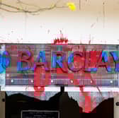 All the windows of the Barclays Bank branch in the centre of Bristol have been smashed and graffiti sprayed over them in a co-ordinated attack by a group targeting the bank. 