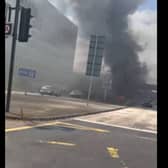 Thick plumes of black smoke covered the area after the car caught fire -Credit:Rick Bache/Facebook