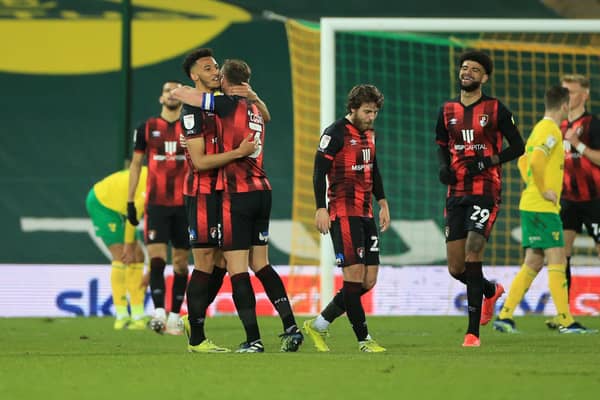 Lloyd Kelly celebrates with Steve Cook after scoring Bournemouth's third goal at Norwich City. (Photo by Stephen Pond/Getty Images)