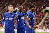 Noni Madueke (R) celebrates scoring Chelsea's second goal with teammates Cole Palmer (L) and Nicolas Jackson during their win at Sheffield United. (Photo by Jan Kruger/Getty Images)