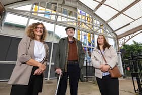  Cate Watkinson, Mike Davis and Rita Griskonyte with the restored stained glass art work at Monkseaton Metro station. 