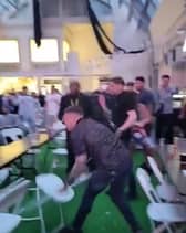 Men can be seen throwing chairs across the room at the Winter Gardens first Euros Fanzone match. 