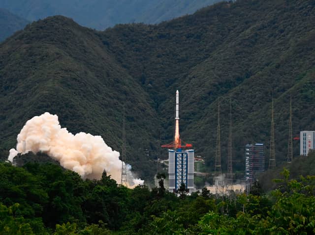 A rocket successfully lifts off from a space base in Xichang, in China's southwestern Sichuan province on June 22, 2024. (Photo by ADEK BERRY/AFP via Getty Images)