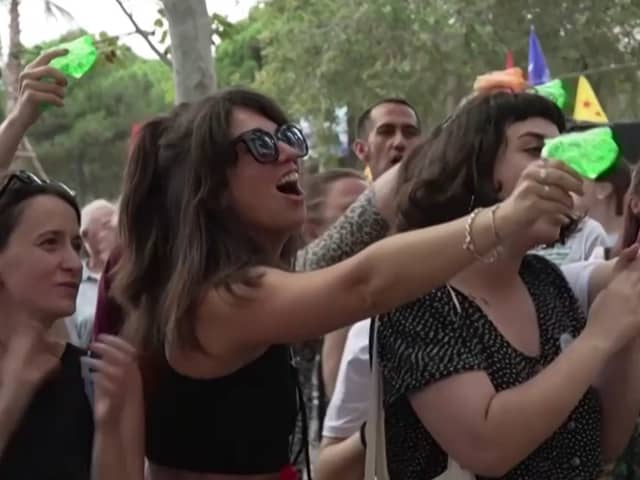Anti-mass-tourism protesters squirt diners with water guns in Barcelona, Spain.