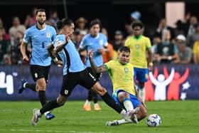 Darwin Nunez of Uruguay and Bruno Guimaraes of Brazil  battle for the ball during the CONMEBOL Copa America 2024 quarterfinal match between Uruguay and Brazil at Allegiant Stadium on July 06, 2024 in Las Vegas, Nevada. (Photo by Candice Ward/Getty Images)