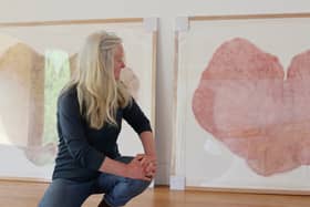 Printmaker Shona Branigan with the Heartwood prints she created from a disc of the felled Sycamore Gap tree. Shona Branigan.jpg