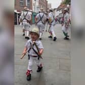 Two-year-old Toby dances along with father’s Morris dance group.