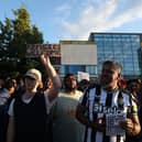 People attend a counter demonstration against an anti-immigration protest called by far-right activists, outside the United Immigration Services offices at The Beacon on Westgate Road.