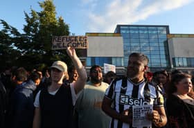People attend a counter demonstration against an anti-immigration protest called by far-right activists, outside the United Immigration Services offices at The Beacon on Westgate Road.