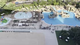 Tourists race to get sunbeds after queuing for pool to open.