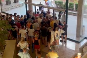Holidaymakers queue at the doors of the Villa Romana hotel in Salou, Spain at 7.55am, on August 7, before making a chaotic dash for the sunbeds. 