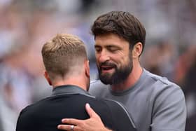Russell Martin, Manager of Southampton, embraces Eddie Howe, Manager of Newcastle United. (Photo by Stu Forster/Getty Images)