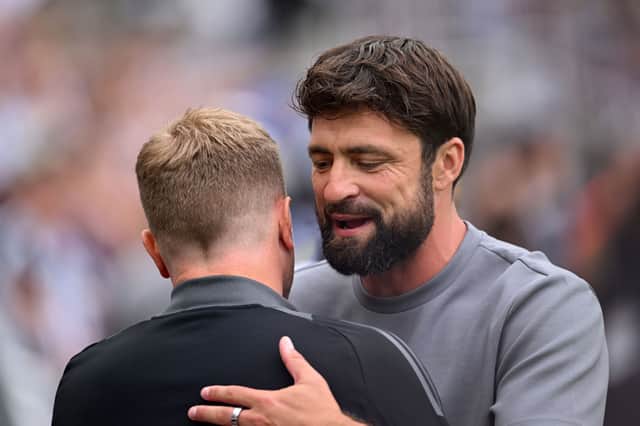 Russell Martin, Manager of Southampton, embraces Eddie Howe, Manager of Newcastle United. (Photo by Stu Forster/Getty Images)