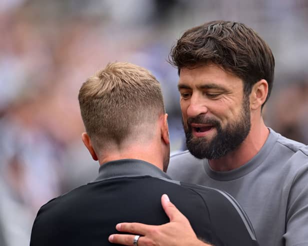 Russell Martin, Manager of Southampton, embraces Eddie Howe, Manager of Newcastle United. (Photo by Stu Forster/Getty Images)