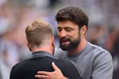 Russell Martin, Manager of Southampton, embraces Eddie Howe, Manager of Newcastle United. (Photo by Stu Forster/Getty Images)