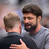 Russell Martin, Manager of Southampton, embraces Eddie Howe, Manager of Newcastle United. (Photo by Stu Forster/Getty Images)