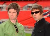 Oasis band members Noel (left) and Liam Gallagher are pictured during a photo call at Wembley Stadium. 