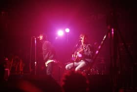Liam Gallagher and Noel Gallagher of Oasis perform on stage at The Electric Ballroom, Camden on May 9 1996 (Photo by Getty Images) 