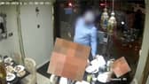 Man allegedly distracts diners before ‘swiping phone’.