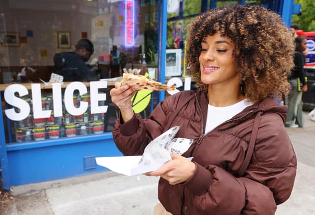 Crowds gather at the Hackney pop-up pizza bar, where Slice is offering free pizza and raising awareness about the financial challenges facing young adults