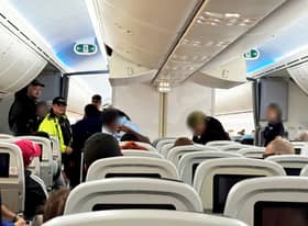 A group of seven drunk and unruly passengers were arrested by armed police officers at Gatwick Airport on October 10 after causing chaos on a flight from Cancun.