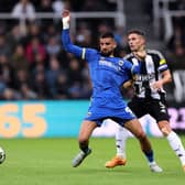 Omar Bugiel of AFC Wimbledon is challenged by Fabian Schaer of Newcastle United. England. (Photo by George Wood/Getty Images)
