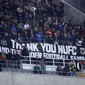 Fans of AFC Wimbledon display a banner thanking Newcastle United. (Photo by George Wood/Getty Images)