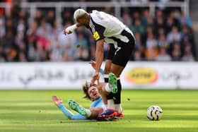 Jack Grealish of Manchester City clashes with Joelinton of Newcastle United. (Photo by Matt McNulty/Getty Images)