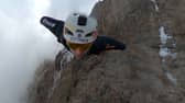 Wingsuit jumper Tim Howell leaps off Mount Kilimanjaro at 5,450m.