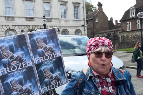 Protester speaks at winter fuel cuts rally.