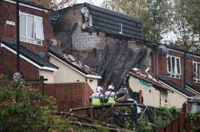 Firefighters and emergency services inspect the scene of an explosion in Benwell. Northumbria police confirmed that a child had died and six people were taken to hospital following the explosion of a house. 