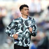 Lewis Miley of Newcastle United warms up prior to the Premier League match between Newcastle United FC and Brighton & Hove Albion FC at St James' Park on October 19, 2024 in Newcastle upon Tyne, England. (Photo by George Wood/Getty Images)