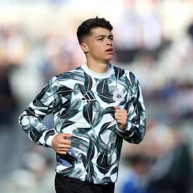 Lewis Miley of Newcastle United warms up prior to the Premier League match between Newcastle United FC and Brighton & Hove Albion FC at St James' Park on October 19, 2024 in Newcastle upon Tyne, England. (Photo by George Wood/Getty Images)