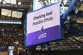 The LED screen displays a VAR check is underway for a possible offside in relation to a goal scored by Cole Palmer of Chelsea (not pictured) during the Premier League match between Chelsea FC and Newcastle United FC at Stamford Bridge on October 27, 2024 in London, England. (Photo by Mike Hewitt/Getty Images)