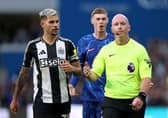 Cole Palmer of Chelsea and Bruno Guimaraes of Newcastle United react towards Referee Simon Hooper after he reverses his original decision of 'penalty' following a VAR review during the Premier League match between Chelsea FC and Newcastle United FC at Stamford Bridge on October 27, 2024 in London, England. (Photo by Ryan Pierse/Getty Images)