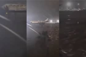 Valencia Airport runway submerged in flood water.