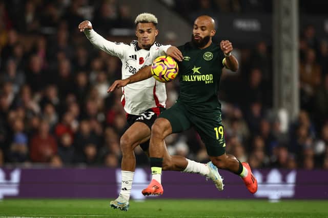 Antonee Robinson challenges Bryan Mbeumo.