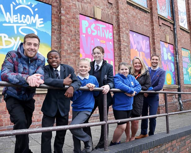 A street art installation celebrating community pride has been unveiled in the heart of the Byker estate. 

From left to right, artist MarkOne87 (Mark Shields), with pupils from Byker Primary and Benfield School, Michelle Bell, Assistant Director of Byker Community at Karbon Homes and Rob Watson, Assistant Head at Byker Primary 